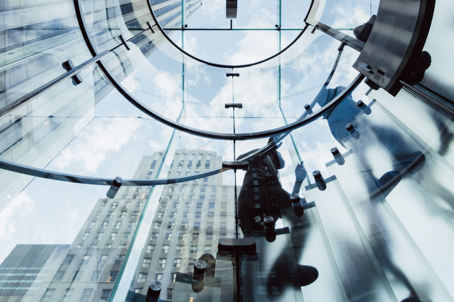 low-angle-shot-of-a-circular-transparent-stairway