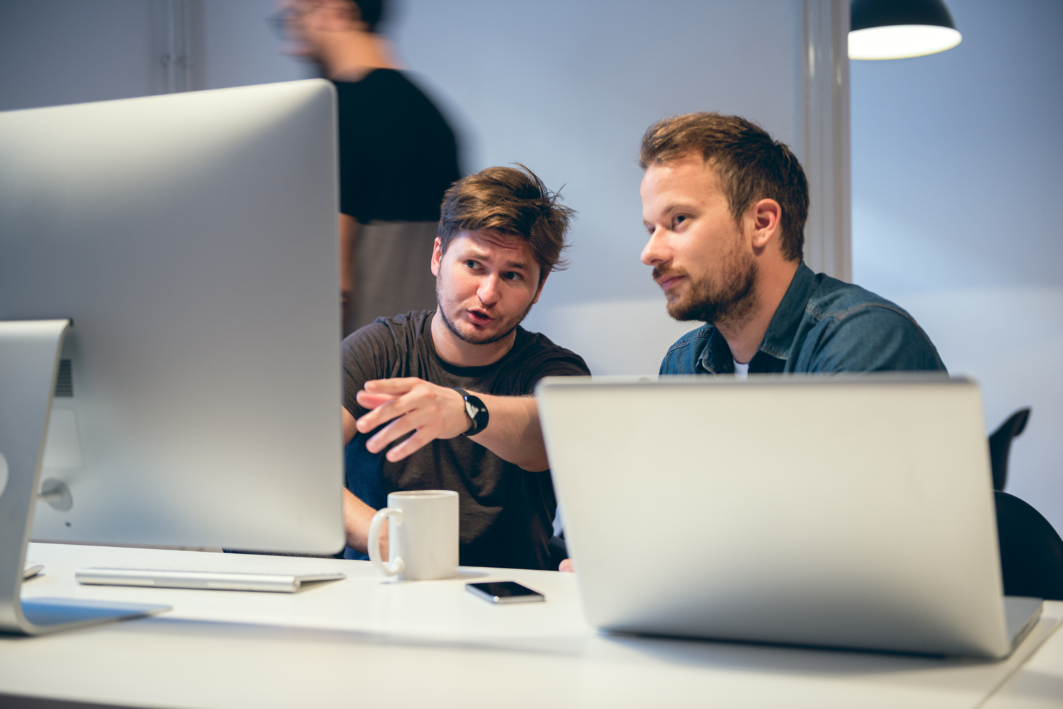 An accountant and a client sitting at a computer using CCH ProSystem fx Planning
