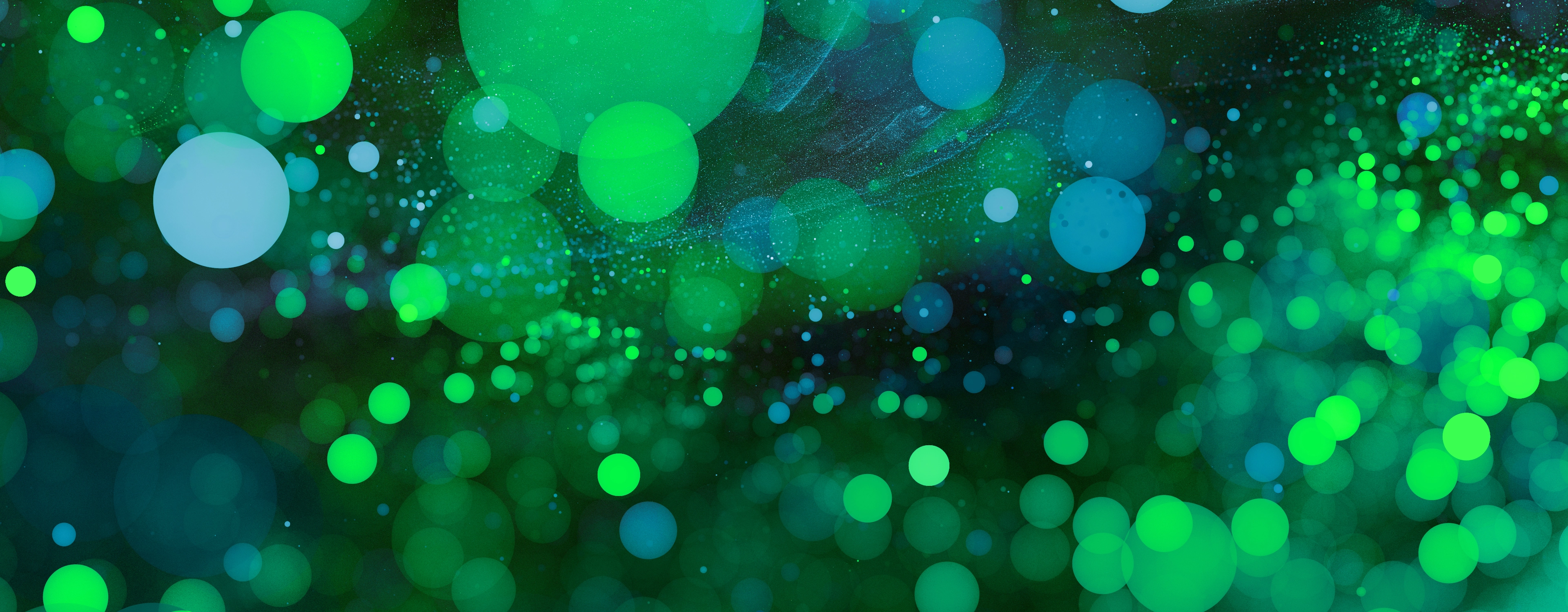 Abstract Green bokeh background. Sparkling spray and circles with depth blur. Fractal artwork for creative design