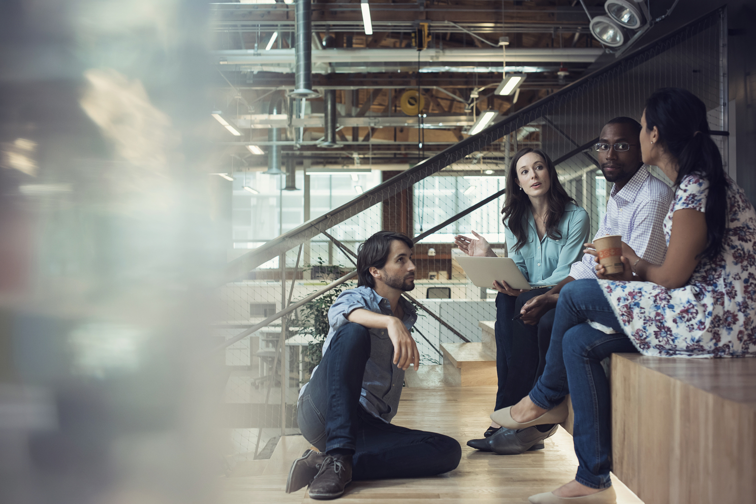 Business people from multi-ethnic background sitting casually and brainstorming together. Business, Los Angeles, USA